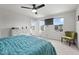 Inviting bedroom with a large bed, ceiling fan, and bright natural light at 1110 Bent Willow Dr, Durham, NC 27704