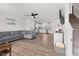 Spacious living room featuring hardwood floors and ample natural light with an open concept to the kitchen at 1110 Bent Willow Dr, Durham, NC 27704