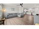 Open-concept living area with hardwood floors, neutral paint, and a seamless transition to the modern kitchen at 1110 Bent Willow Dr, Durham, NC 27704