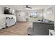 Bright living room boasting hardwood floors, a modern ceiling fan, and a seamless flow into other living spaces at 1110 Bent Willow Dr, Durham, NC 27704