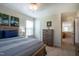 Comfortable bedroom features natural light, a queen bed, and tasteful décor perfect for relaxation and rest at 112 Red Admiral Ct, Hillsborough, NC 27278