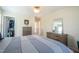 Bright bedroom featuring modern furniture, a walk-in closet, and neutral tones creating a serene atmosphere at 112 Red Admiral Ct, Hillsborough, NC 27278
