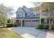 Charming two-story home with a two-car garage and well-maintained landscaping at 112 Red Admiral Ct, Hillsborough, NC 27278