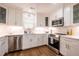 Contemporary kitchen with stainless steel appliances, white cabinets, and hardwood floors at 112 Red Admiral Ct, Hillsborough, NC 27278