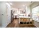 Bright kitchen featuring white cabinets, stainless steel appliances, and a built-in storage area at 112 Red Admiral Ct, Hillsborough, NC 27278