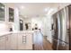 Modern kitchen with stainless steel appliances and a view of the entry way and living room at 112 Red Admiral Ct, Hillsborough, NC 27278