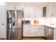 Bright kitchen features stainless steel appliances and custom cabinetry at 112 Red Admiral Ct, Hillsborough, NC 27278
