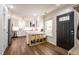 Modern kitchen with stainless steel appliances and ample counter space and a dark front door at 112 Red Admiral Ct, Hillsborough, NC 27278