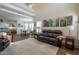 Spacious living room featuring hardwood floors, an open floor plan, and views to the dining area at 112 Red Admiral Ct, Hillsborough, NC 27278