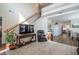 Open-concept living room with a staircase, hardwood floors, and access to the kitchen and dining area at 112 Red Admiral Ct, Hillsborough, NC 27278