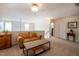 Upstairs living room with a comfortable sofa and ample natural light at 112 Red Admiral Ct, Hillsborough, NC 27278