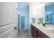 Main bathroom with double sink vanity, walk-in shower and a separate water closet at 112 Red Admiral Ct, Hillsborough, NC 27278