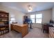 Bright office space featuring a large desk, dual monitors, and built-in shelving for efficient work-from-home setup at 112 Red Admiral Ct, Hillsborough, NC 27278