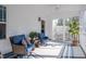 Cozy screened porch with wicker seating, a ceiling fan, and natural light at 112 Red Admiral Ct, Hillsborough, NC 27278