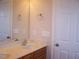 Bathroom with double sinks set in light cabinets, complemented by ample mirror space and a linen closet at 1215 Agile Dr, Knightdale, NC 27545