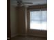 Bedroom with carpet flooring and natural light streaming through a window with blinds at 1215 Agile Dr, Knightdale, NC 27545