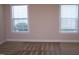 Bright room with two windows offering natural light and views; carpet and neutral walls create a cozy space at 1215 Agile Dr, Knightdale, NC 27545