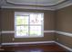 Dining room with hardwood floors, chair rail molding, and a chandelier at 1215 Agile Dr, Knightdale, NC 27545