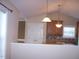 Open kitchen area featuring wood cabinets, a breakfast bar, and pendant lighting at 1215 Agile Dr, Knightdale, NC 27545