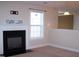 Cozy living room showcasing a fireplace with a white mantel and adjacent built-in shelving at 1215 Agile Dr, Knightdale, NC 27545