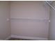 Walk-in closet with neutral walls and carpet flooring, featuring wire shelving to provide storage space at 1215 Agile Dr, Knightdale, NC 27545
