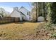 Fenced backyard featuring mature trees, lawn and white siding at 12325 Inglehurst Dr, Raleigh, NC 27613