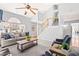 Spacious living room with a soaring ceiling, fireplace, staircase, and ample seating at 12325 Inglehurst Dr, Raleigh, NC 27613