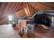 Unfinished attic with exposed wooden beams and ductwork, offering potential for customization at 125 Kelekent Ln, Cary, NC 27518