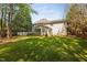 Large, well-maintained backyard with ample green space and screened porch, ideal for outdoor activities at 125 Kelekent Ln, Cary, NC 27518