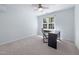 Bedroom featuring carpet, a ceiling fan, and a window allowing natural light to illuminate the space at 125 Kelekent Ln, Cary, NC 27518