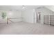 Expansive bonus room featuring neutral carpet, ample natural light, and built-in shelving at 125 Kelekent Ln, Cary, NC 27518