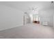 Bright bonus room with neutral carpet, natural light, a built in desk and white shelving at 125 Kelekent Ln, Cary, NC 27518
