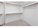 Walk in closet with carpet, shelves and wood trim at 125 Kelekent Ln, Cary, NC 27518