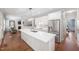 Open kitchen layout with island, stainless appliances, and a view to the living area at 125 Kelekent Ln, Cary, NC 27518