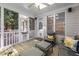 Charming screened porch with seating, offering a cozy space to enjoy the outdoors at 125 Kelekent Ln, Cary, NC 27518