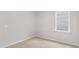 Inviting bedroom with plush carpeting, neutral walls, and a bright window for ample sunlight at 128 Pisgah St, Sanford, NC 27330