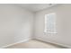 Neutral bedroom featuring plush carpeting and a bright window, perfect for relaxation at 128 Pisgah St, Sanford, NC 27330