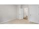 Bright bedroom with plush carpet and white doors leading to additional spaces at 128 Pisgah St, Sanford, NC 27330