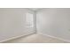 Cozy bedroom featuring plush carpeting and a bright window offering natural light at 128 Pisgah St, Sanford, NC 27330