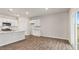 Spacious kitchen and dinette area with sleek wood floors and abundant natural light at 128 Pisgah St, Sanford, NC 27330