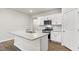 Bright kitchen boasts granite countertops, stainless steel appliances, and ample storage space at 128 Pisgah St, Sanford, NC 27330