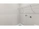 A laundry room with white walls, tile floors, and hookups for a washer and dryer at 128 Pisgah St, Sanford, NC 27330