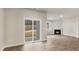 Open living room featuring modern fireplace and sliding glass doors to the patio at 128 Pisgah St, Sanford, NC 27330