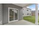 A covered patio featuring a gray exterior and sliding glass doors at 128 Pisgah St, Sanford, NC 27330