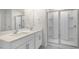 Bright bathroom with dual vanity, quartz countertop, and stand up shower with glass doors at 129 Pisgah St, Sanford, NC 27330