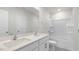 Bright bathroom with dual vanity, quartz countertop, and stand up shower with glass doors at 129 Pisgah St, Sanford, NC 27330
