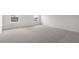 Bright bedroom with neutral carpet and a large window for lots of natural light at 129 Pisgah St, Sanford, NC 27330