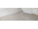 Spacious bedroom with neutral carpet, white walls, and an open doorway leading to another room at 129 Pisgah St, Sanford, NC 27330