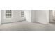 Bedroom with neutral carpeting, white walls, and natural light from the windows at 129 Pisgah St, Sanford, NC 27330