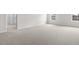 Bright bedroom with neutral carpet and a large window for lots of natural light at 129 Pisgah St, Sanford, NC 27330